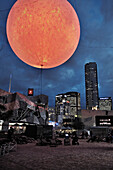 Light installation of sun at night, sculpture artwork, Melbourne, Vicoria, Australia