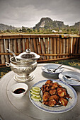Chicken Dish at terrace of cosy restaurant, Vieng Xai around Sam Neua, Houaphan, Highlands, Laos