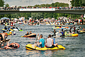 Participants and spectators at Nabada on the river Danube, Schwoerwoche, Ulm festival, Baden-Wuerttemberg, Germany