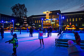 People ice skating at the Christmas market, Karlsruhe, Baden-Württemberg, Germany