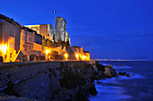 Illuminated old town and Chateau Grimaldi in the evening, Antibes, Cote d'Azur, South France, Europe