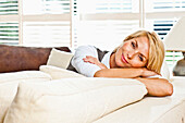 Young women relaxing on a sofa, Hamburg, Germany