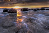 Moeraki boulders at dawn as SW front passes overhead, near Oamaru, Otago