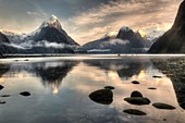 Mitre peak, winter dawn, cold mist rising from Milford Sound, Fiordland National Park