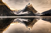 Mitre peak reflection, winter dawn, Milford Sound, Fiordland National Park.