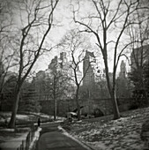 Path and Bridge in Central Park With Fifth Avenue Buildings in Background in Winter, New York City, USA