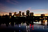 The Arkansas river and the city skyline of Little Rock Arkansas at dusk