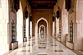 Arched hallways of the Grand Mosque in Muscat, Oman
