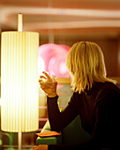 Woman in a hotel bar, Travemuende, Luebeck, Schleswig-Holstein, Germany