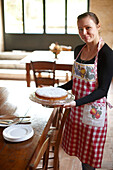 Woman with breakfast cake, Agriturismo and vineyard Ca' Orologio, Venetia, Italy