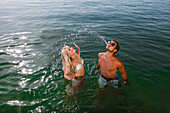 Young couple bathing in Lake Starnberg, Bavaria, Germany