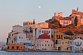 Faros-Coupa Bar, the mosque and the red castle at dusk, Kastelorizo Megiste, Dodecanese Islands, Greece, Europe