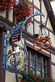 Alsace wine route Equisheim France wine town street scene colorful bakery shop sign