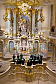 A choir performs a concert inside the Frauenkirche church, Dresden, Saxony, Germany