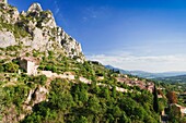 View of the village Moustiers-Sainte Marie withe the Porte fortifiée du Riou in the foreground, France, Europe