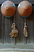 Buddhist monks' straw sandals and hats hang in the entryway of Taizo-in (established in 1404), the oldest sub-temple of Myoshinji Temple, located in Kyoto, Japan.