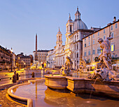 Fountain of the Four Rivers, Fontana dei Quattro Fiumi and church, Sant'Agnese in Agone in the evening light, Piazza Navona, Rome, Lazio, Italy