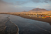 Fishing boats and cars on beach at sunset, Salaverry near Trujillo, La Libertad, Peru, South America