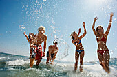 Group of people splashing in the sea. Group of people splashing in the sea