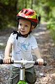 Toddler boy riding bike. Toddler boy riding bike