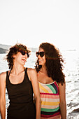 Laughing women in sunglasses on beach. Laughing women in sunglasses on beach