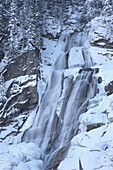 The Krimml waterfalls in the National Park Hohe Tauern during winter in ice and snow  The upper Fall  The Krimml waterfalls are one of the biggest tourist attractions in Austria and the Alps  They are visited by around 400 000 tourists every year  The wat