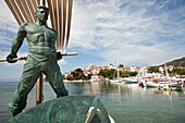 monument of the Unknown Sailor and the old harbour in Skiathos town, Skiathos Island, Northern Sporades, Greece