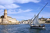 Man sailing in a yacht with Saint Jean Fort in the background, Marseille, France