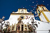 People throw flowers petals toward a wooden statue of the Virgin Carmen is publicly displayed during a Holy Week procession in the town of Prado del Rey in southern Spain´s Cadiz Sierra region in Andalucia, April 4, 2008  Easter processions in Andalucia d