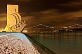 Padrão dos Descobrimentos Monument to the Discoveries dated 1960 and 25 de Abril Bridge over Tejo river, Belem District, Lisbon, Portugal, Europe