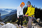 Two climbers preparing for climbing, Kampenwand, Chiemgau Alps, Chiemgau, Upper Bavaria, Bavaria, Germany