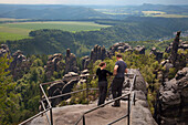 Hikers at the viewpoint from Schrammsteine Rocks, National Park Saxon Switzerland, Elbe Sandstone Mountains, Saxony, Germany, Europe