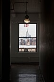 New York - United States, panoramic view on Manhattan skyline and the Empire State building, from artist lofts in Dumbo area