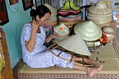 Asia, Southeast Asia, Vietnam, Centre region, Hue, old woman weaving hats