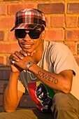 'Africa, South Africa, Gauteng Province, Johannesburg city, South Western Township, Orlando West Quarter, Lebo Malepa very proud of his origins has tattooed ''Soweto'' on his arm and is the boss of ''Lebo's Soweto Backpackers'''