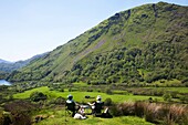 Wales,Gwynedd,Elderly Couple Picnicking in Snowdonia National Park