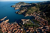 France, Pyrenees-Orientales (66), Collioure, a port city and resort on the coast of Vermilion, the Royal Castle and the fortified church, Our Lady of the Angels, are listed as historical monument in the distance, Port Vendres and Fort Bear (aerial view)