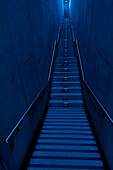 Long steps with gloomy light toward the exit.  A staircase, with low light. Taipei city, Taiwan, Asia., A long narrow flight of stairs