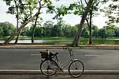 A tour bike. A bicycle with basket parked on the road to the Angkor Temples., Siem Riep, Cambodia. A bicycle.