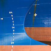 Detail of the markings on the hulls of two deep sea fishing trawlers anchored in Fraserburgh harbour, Aberdeenshire, Scotland., Hulls of two deep sea trawlers