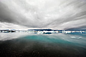 The Iceberg lake Jokulsarlon in South Iceland, where the glacier ends, and the ice cold waters carry icebergs to the sea., Jokulsarlon, Iceland