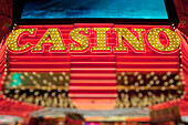 The Casino entrance to a building in the gambling and entertainment centre of Las Vegas city. Neon lights. Night life.