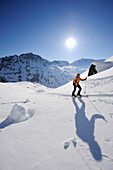 Woman backcountry skiing, ascending towards Madrisajoch, Madrisajoch, Raetikon, Montafon, Vorarlberg, Austria