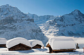 Deep snow at some alpine stables and huts above Grindelwald, Jungfrauregion, Bernese Oberland, Canton Bern, Switzerland, Europe