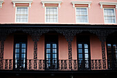 Pink Building With Row of Windows and Wrought Iron Balcony, Charleston, South Carolina, USA