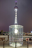 Glass stairway to Apple store in front of Oriental Pearl Tower at night, Pudong, Shanghai, China, Asia