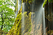 Water running over a moss-covered rock face, Schleierfall, Schleier waterfall, Ammer, Pfaffenwinkel, Garmisch, Upper Bavaria, Bavaria, Germany