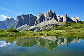Sella range reflecting in a mountain lake, Sella, Dolomites, UNESCO world heritage site Dolomites, South Tyrol, Italy