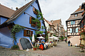 Restaurant and half-timbered houses in Riquewihr, Alsace, France