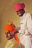 India, Rajasthan, Nagaur district, Panchala Siddha village, Rajput wedding, The dressing of the bridegroom